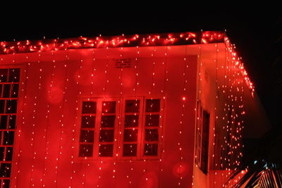 Close-up of illuminated red lights at night