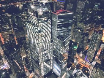 Aerial view of illuminated buildings in city