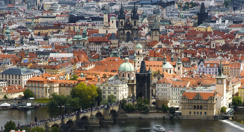High angle view of charles bridge over vltava river in city