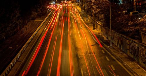 High angle view of light trails on road at night