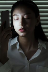 Portrait of woman using mobile phone