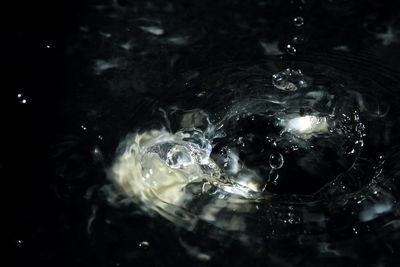 Close-up of drop splashing in water