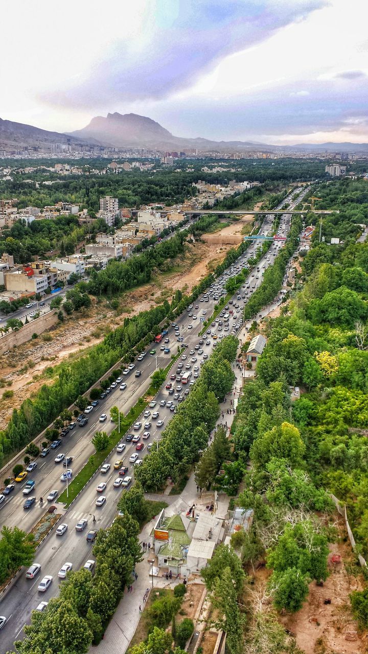 HIGH ANGLE VIEW OF TOWNSCAPE AGAINST SKY IN CITY