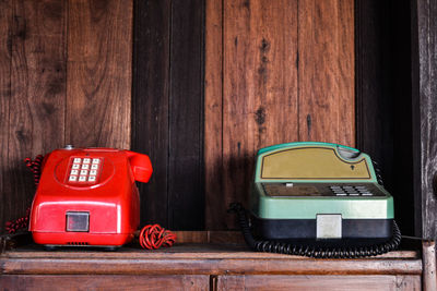 Old telephones on wooden table