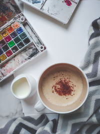 High angle view of coffee cup on table