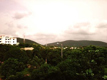 Scenic view of mountains against cloudy sky