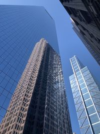 Low angle view of modern buildings against sky