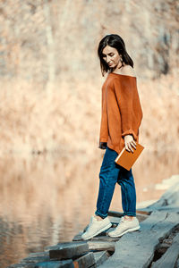 Portrait of smiling woman standing outdoors