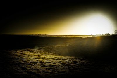 Scenic view of sea against clear sky at sunset