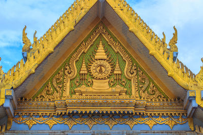 Low angle view of ornate building against sky