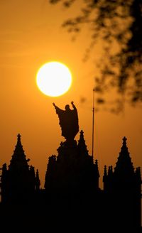 Silhouette of temple against sky during sunset