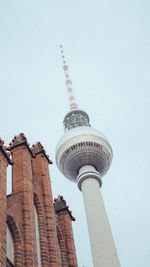 Low angle view of communications tower against clear sky