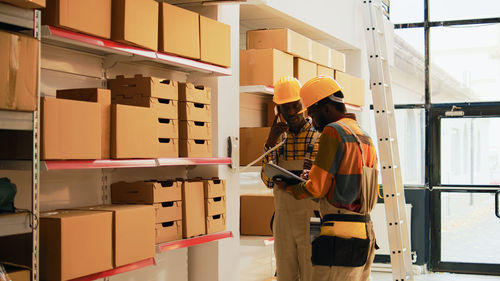 Rear view of man standing in factory