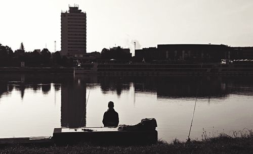 Reflection of buildings in calm lake