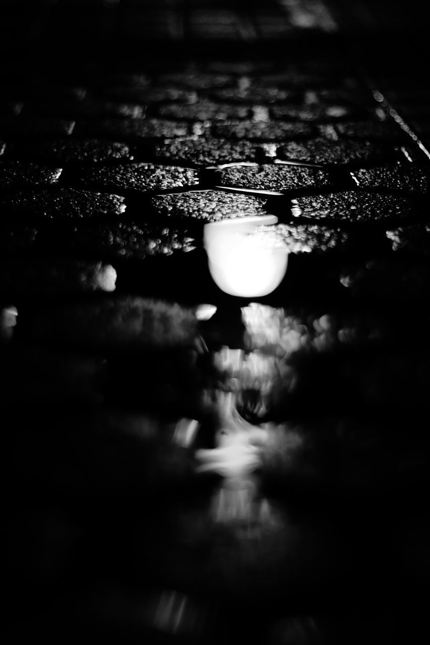 CLOSE-UP OF WATER DROPS ON ILLUMINATED SURFACE