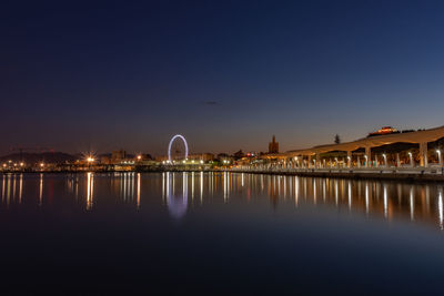 Reflection of illuminated buildings in water