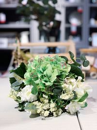 Close-up of rose plant on table