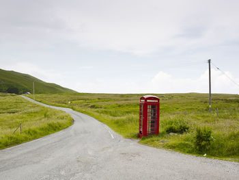 Telephone booth on side of country road