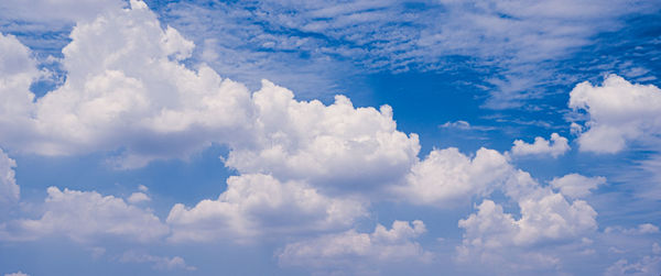 White fluffys clouds with blue sky nature background abstract weather season.