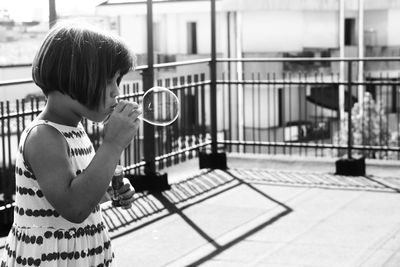 Girl playing with umbrella