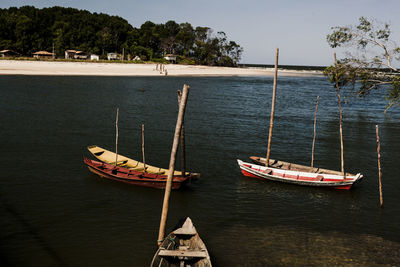 Boat moored in sea against sky