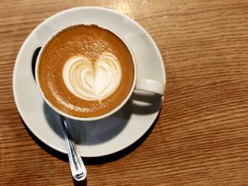 High angle view of cappuccino on table