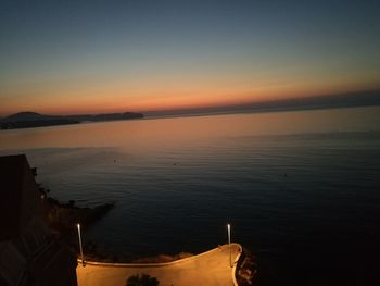 Scenic view of sea against clear sky during sunset