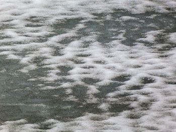 High angle view of footprints on snow