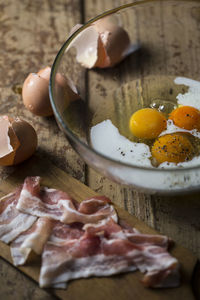 High angle view of meat and eggs on table