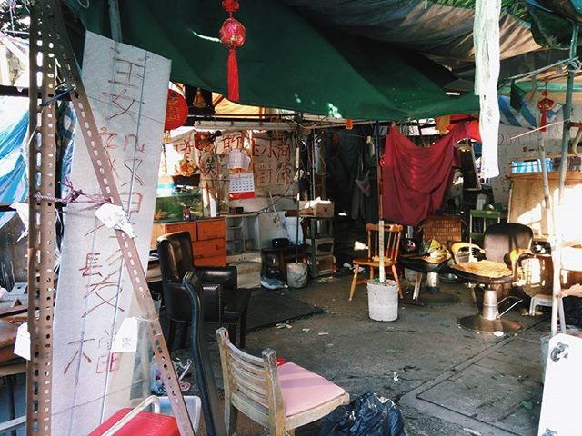 hanging, variation, clothing, laundry, clothesline, retail, in a row, drying, choice, day, indoors, textile, large group of objects, occupation, working, group of objects, rope, abundance, flag, for sale