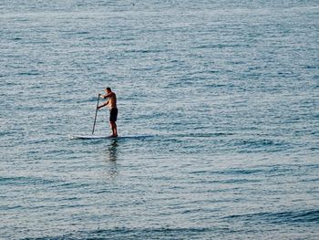 Full length of man standing in sea