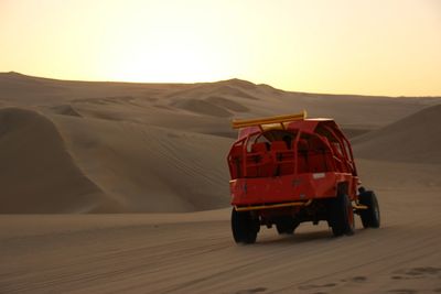 View of desert against sky during sunset