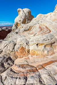 Scenic view of rock formation against blue sky