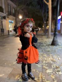 Portrait of girl standing on street