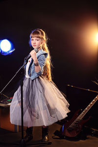 Portrait of girl performing on stage