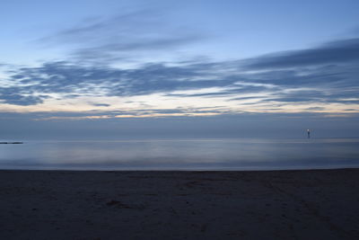 Scenic view of sea against sky at sunset