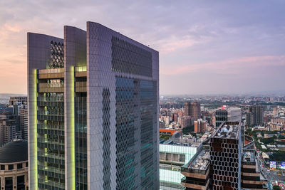 Modern buildings in city against sky