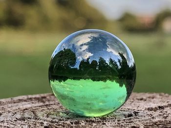 Close-up of crystal ball on field