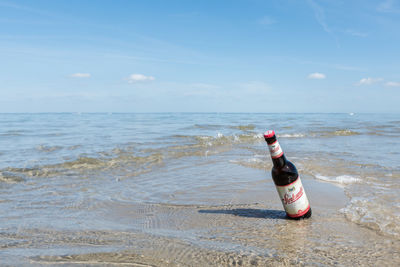 Full length of man on beach against sky