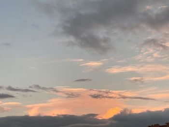 Low angle view of clouds in sky during sunset