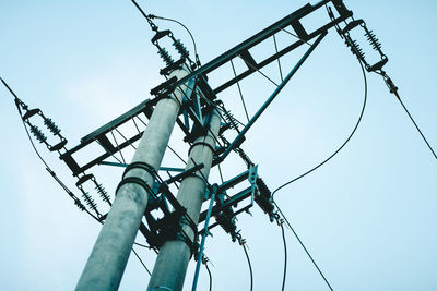 Low angle view of telephone pole against clear sky