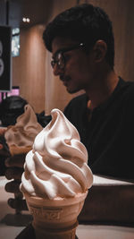 Close-up of young man holding ice cream