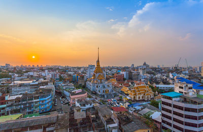 Cityscape against sky during sunset