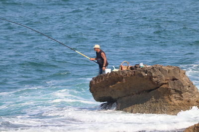 Man fishing in sea