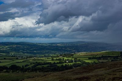 Scenic view of landscape against cloudy sky