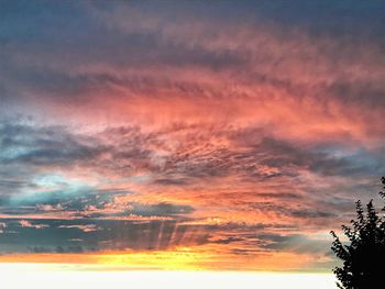 Low angle view of dramatic sky during sunset