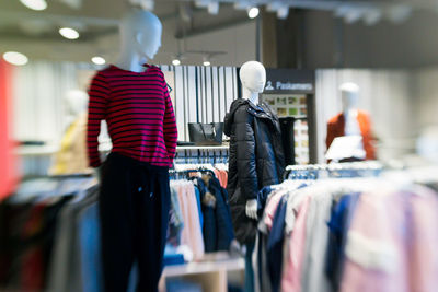 Rear view of man standing in store