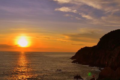 Scenic view of sea at sunset