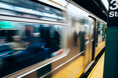 Blurred motion of train at subway station