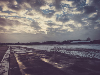 Scenic view of sea against cloudy sky